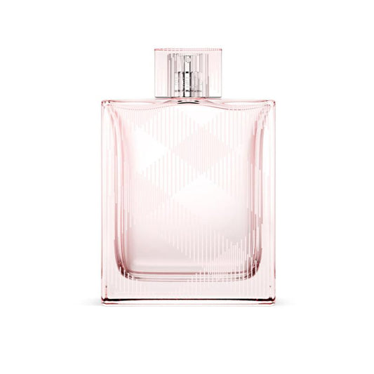 A clear glass perfume bottle with a pink cap, containing Burberry Brit Sheer Eau de Toilette for women. The bottle is sitting on a white background.