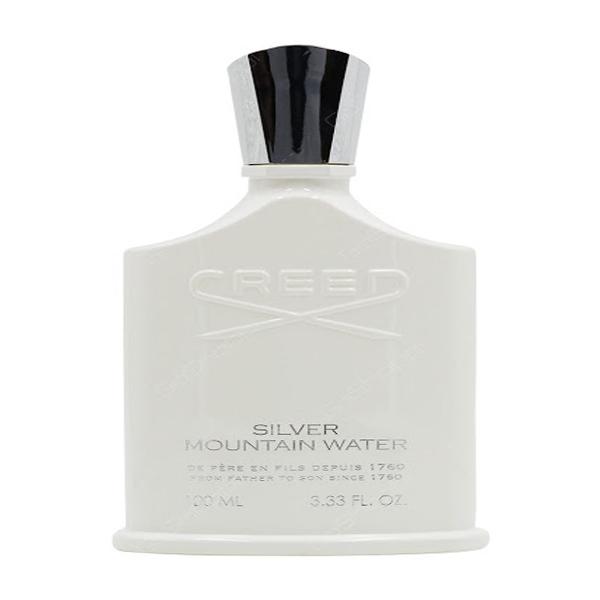 A clear glass perfume bottle containing Creed Silver Mountain Water Eau de Parfum. The bottle has a sleek, minimalist design with a silver cap. The liquid inside is a clear, refreshing color.