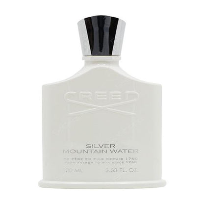 A clear glass perfume bottle containing Creed Silver Mountain Water Eau de Parfum. The bottle has a sleek, minimalist design with a silver cap. The liquid inside is a clear, refreshing color.