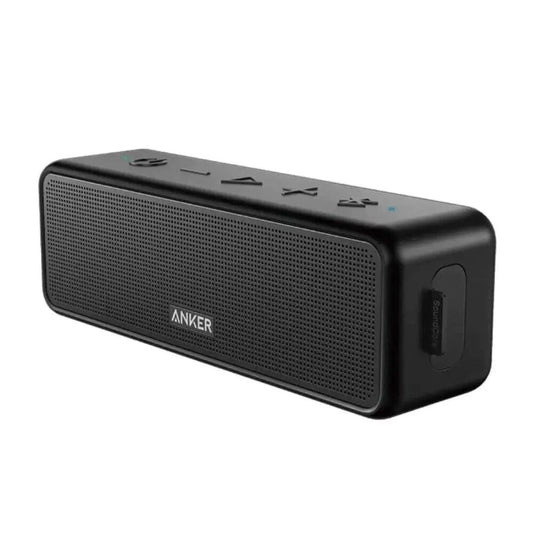 A portable speaker with a sleek design and a black finish. It has a cylindrical shape 