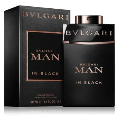 A sleek black glass perfume bottle with a silver cap, featuring the Bvlgari logo. The bottle contains Bvlgari Man in Black Eau de Parfum, with a volume of 100ml.   